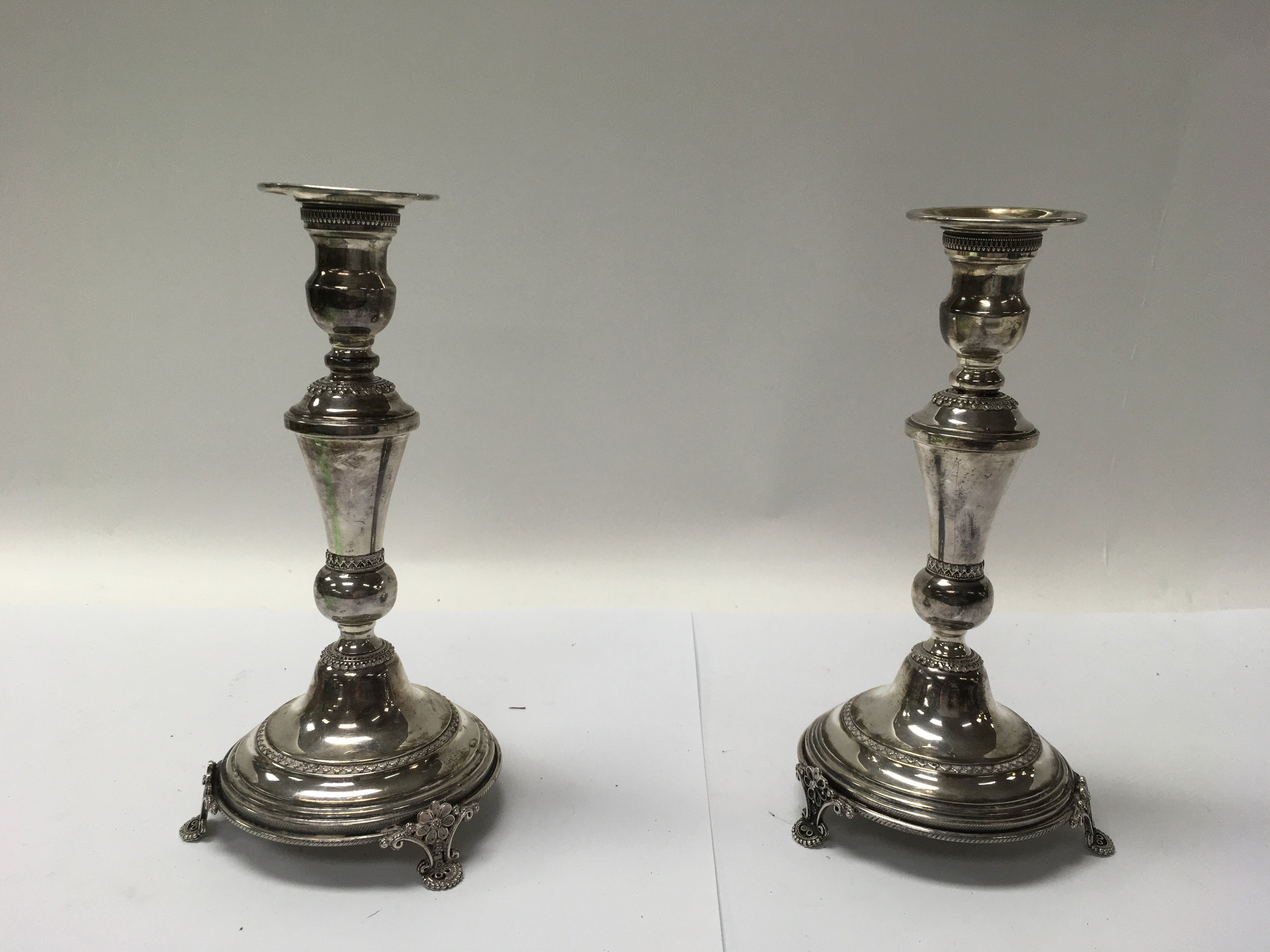 A pair of Jewish silver candlesticks, married Isra