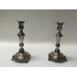 A pair of Jewish silver candlesticks, married Isra