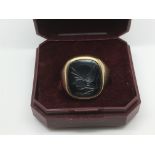 A gent's 9ct gold signet ring inset with the profi