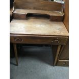 A Ecole desk the raised back above a single drawer