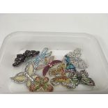 A collection of crystal set butterfly brooches