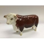 A Beswick figure of a bull, approx length 19cm.