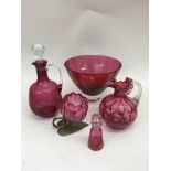 A small group of cranberry glass including two jug