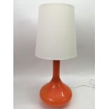 A Verner Panton style squat form orange table lamp