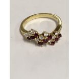A 18 ct gold ring inset with rubies and diamonds