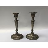 A pair of silver candlesticks awarded to H.N Knox