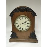 A Victorian bracket clock the case with applied mouldings. Fitted with an oxidised brass double