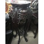 A Chinese hardwood Jardiniere stand inlaid with mo