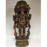 A large carved wood and painted Indian figure of t