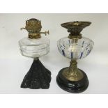 Two brass oil lamps with clear glass reservoirs, n