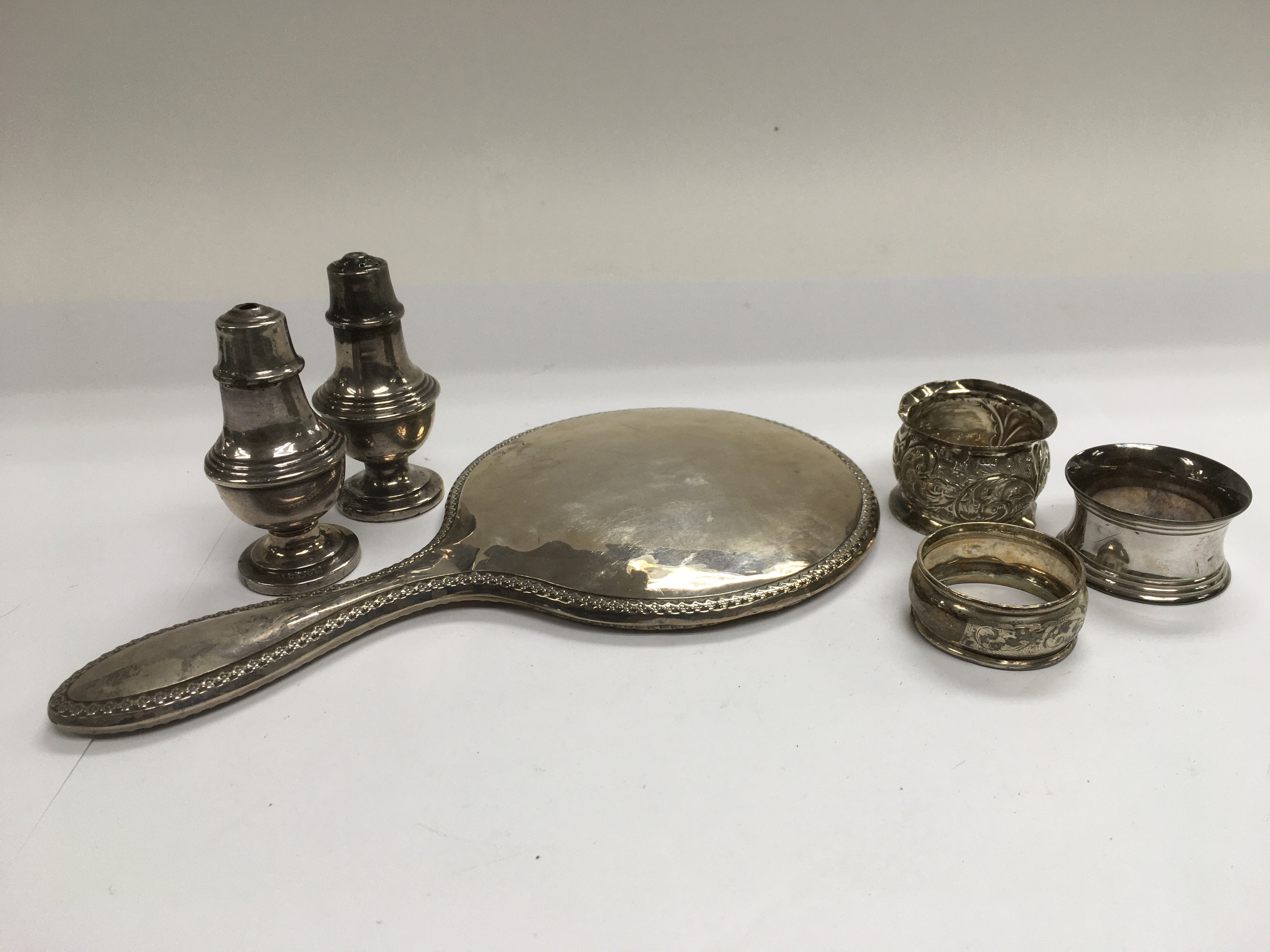 A small collection of silver items including a sil