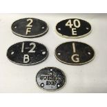 A group of five cast iron train carriage plates, i