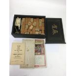 A wooden boxed Mahjong set