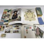 A collection of cigarette cards, stamps, bus ticke