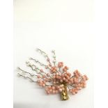 A vintage coral on wire spray brooch