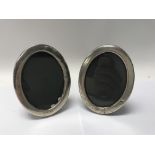 A pair of Concorde silver photo frames bearing hal