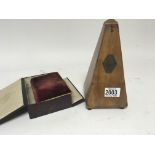 A French Metronome and a velvet covered bible in a