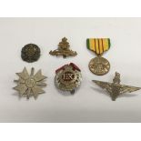 A captured WW2 SS merit cross, other British badge