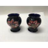 A pair of Moorcroft spring flower pattern vases. H