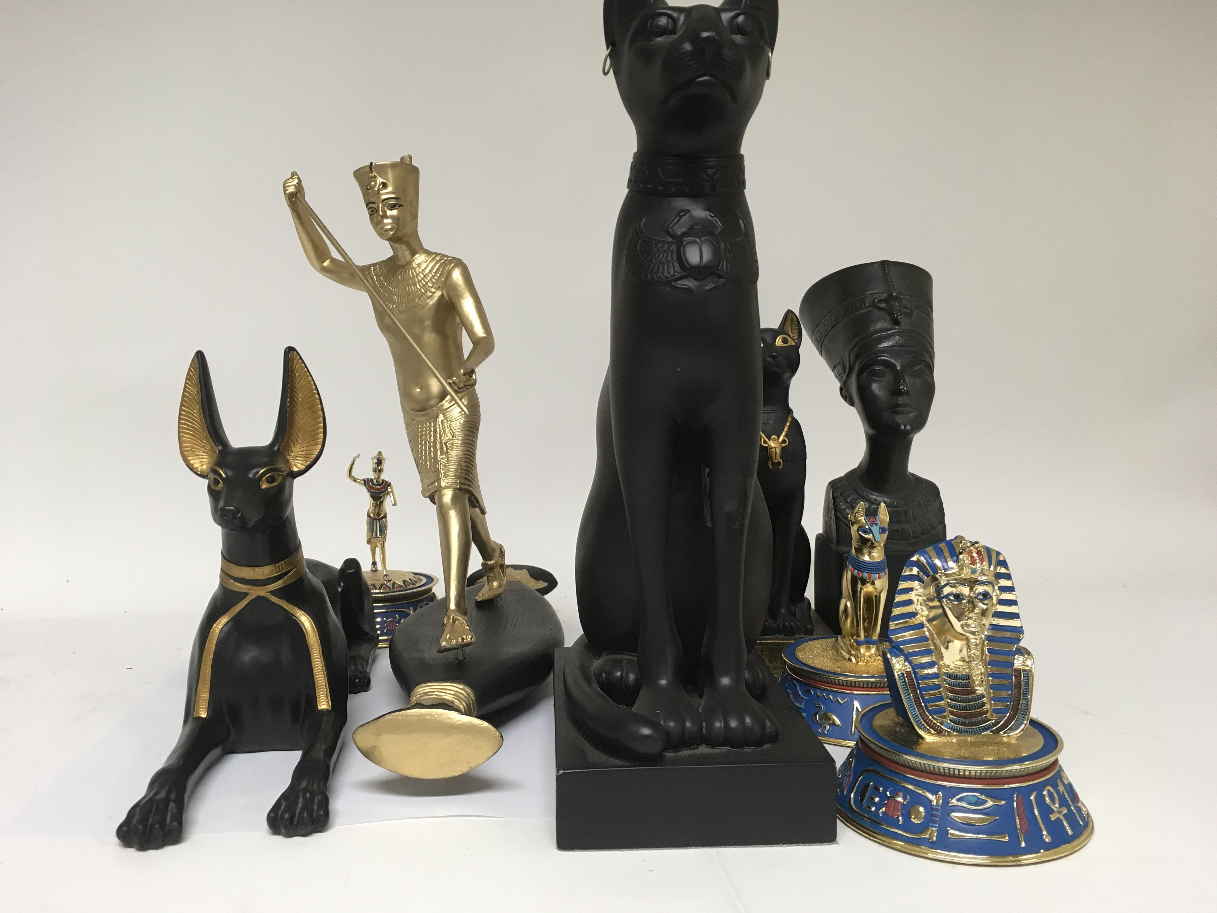 A collection of reproduction Egyptian figures.