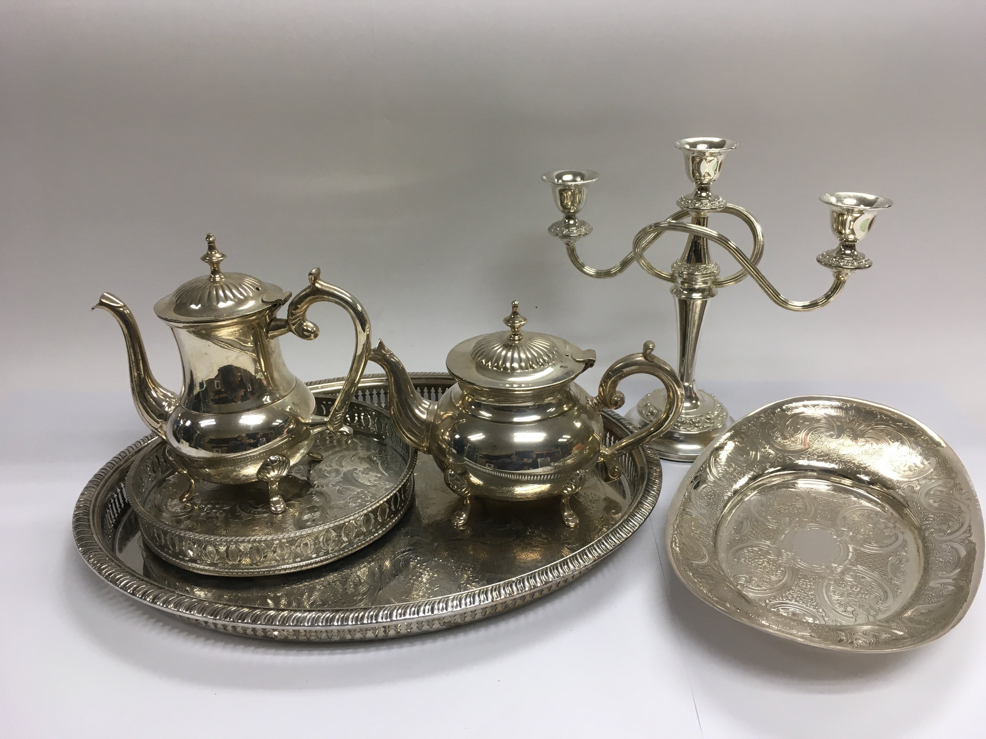 A collection of silver plated items including teap