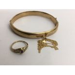 A 9ct gold bangle and stone set ring and a 585 gol