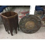 An old wooden Chinese octagonal fold up table with
