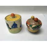 A pair of Clarice Cliff preserve jars. Chips to ri