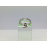 An 18ct white gold ring set with a princess cut di