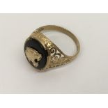 A gent's 9ct gold signet ring set with tiger emble