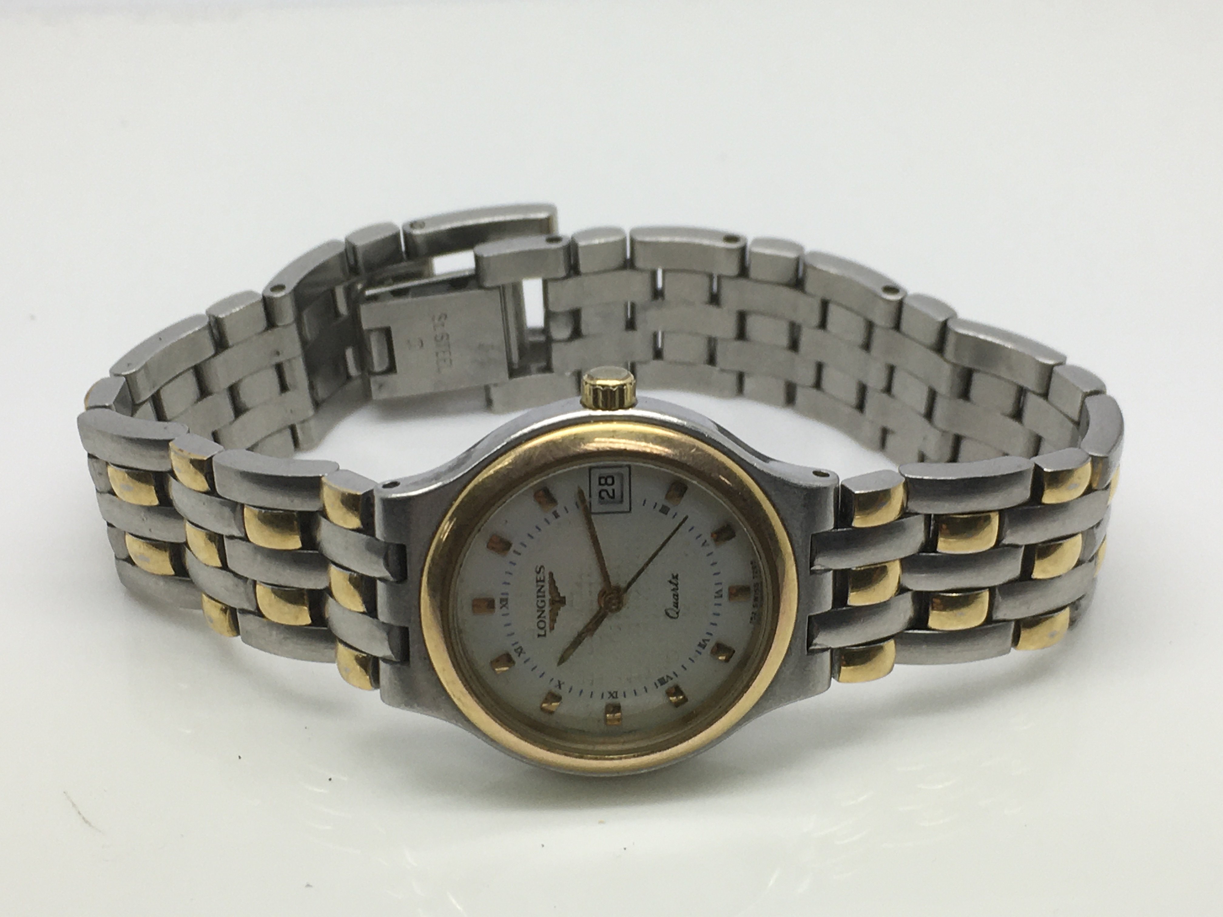 A ladies bi metal Longines watch.