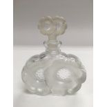 A Lalique perfume bottle with double flowerhead de