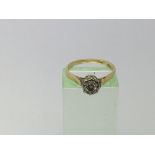 A gold ring set with a solitaire diamond, approx 2