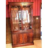 A Mahogany display cabinet with glass shelves abov