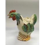 A Clarice Cliff teapot in the form of a cockerel,