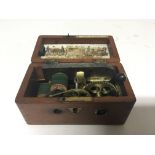A small Victorian Magneto-Electric Machine pocket size in a mahogany case JF. Pratt 43 Oxford St.
