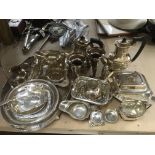 A box of silver plated items.
