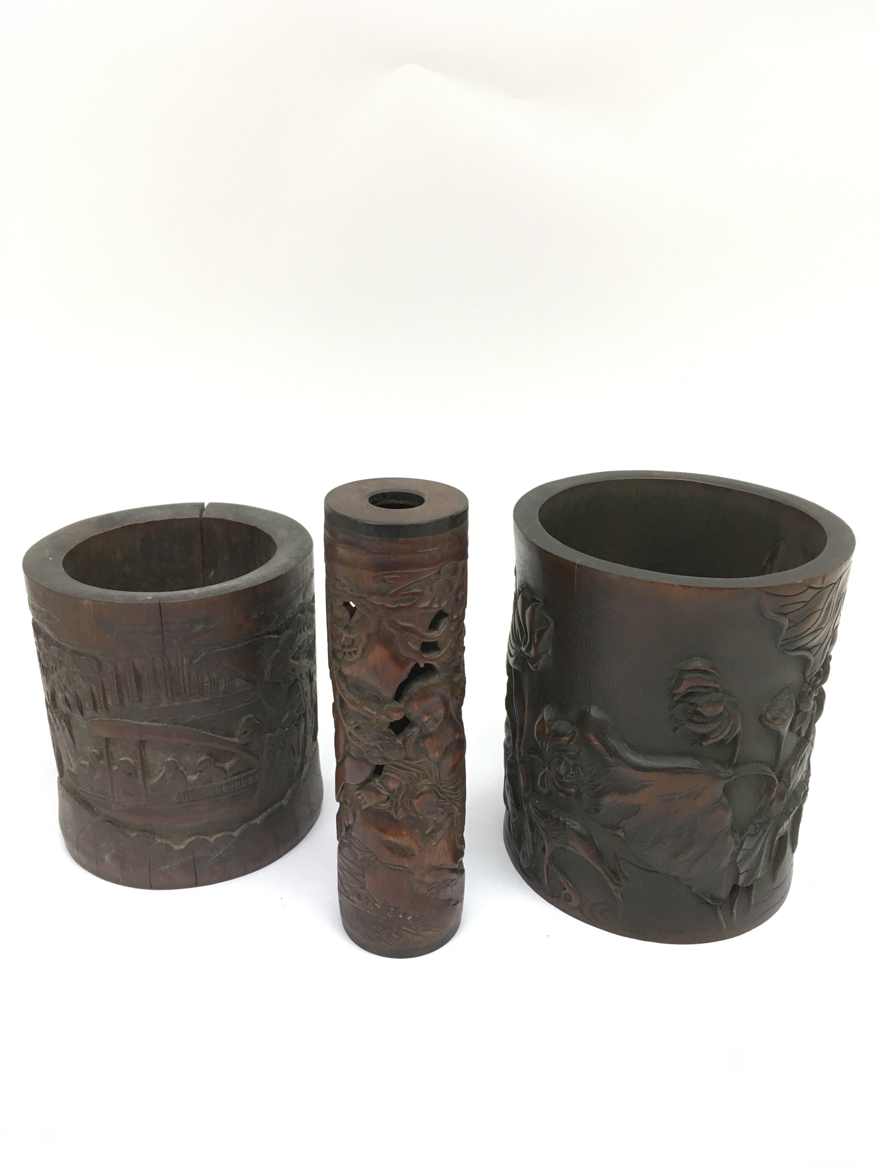 Two carved bamboo brush pots and a similar parfumi
