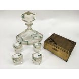 An Art Deco cut glass decanter with four shot glas