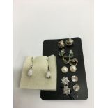 Seven pairs of stud earrings including silver and