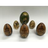 Six Russian decorative wooden eggs.