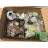 A box containing a collection of various coinage.