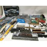 A box containing various toys including model kits