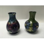 A pair of Pansy pattern moorcroft vases. Height ap