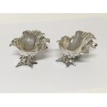 A pair of Rococo influence shell shapes silver sal