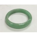 A jade bangle, total weight approx 56 grams.