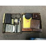 Two boxes containing a collection of old tins incl