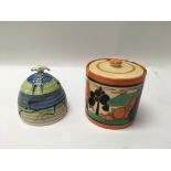A pair of Clarice Cliff preserve jars, one decorat