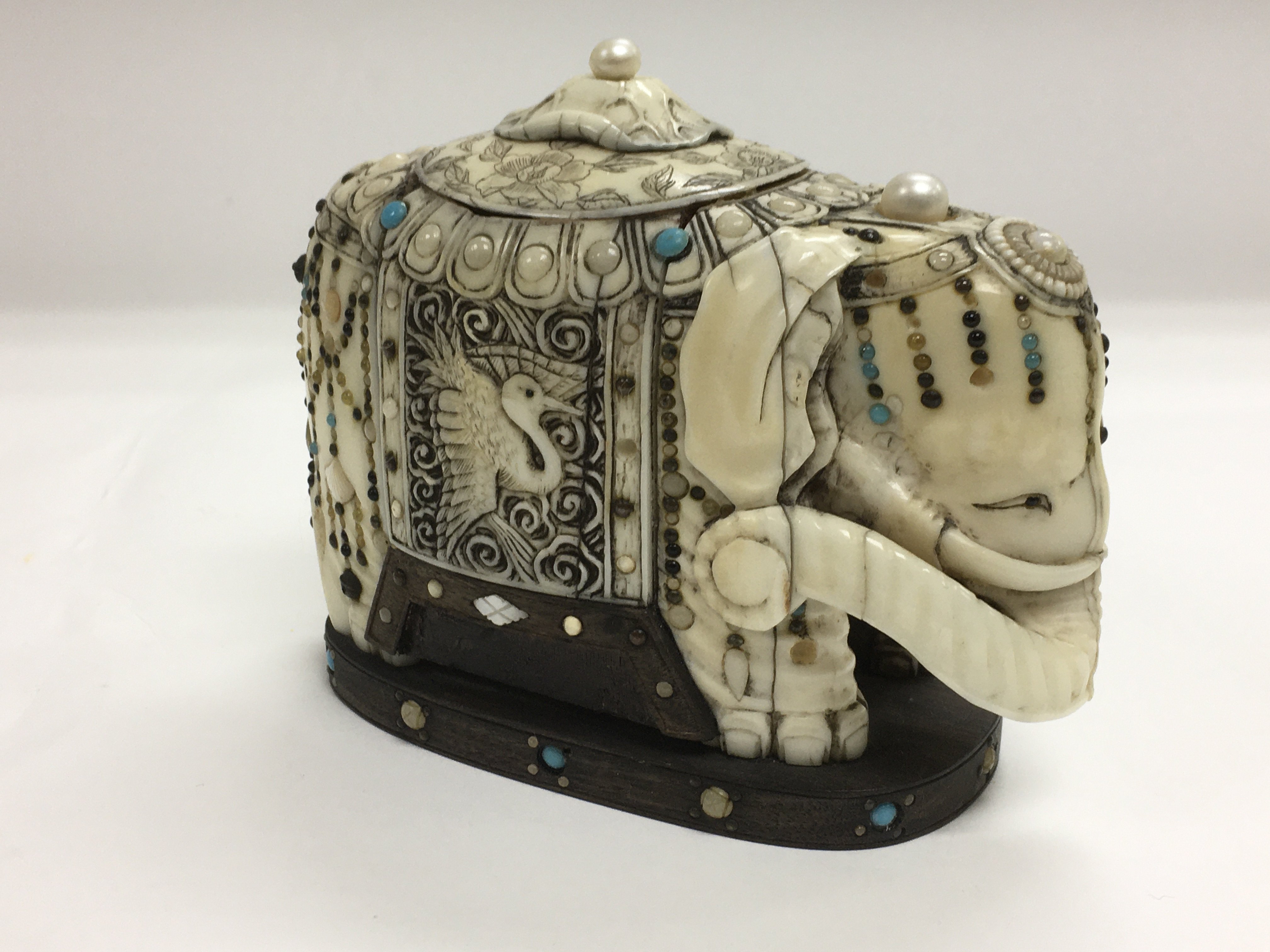 A Moghul style ivory elephant set with turquoise a