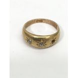 An 18ct gold ring with two small diamonds, lacking